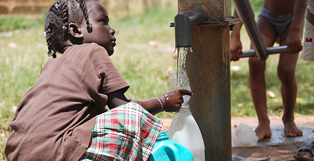 LDS Philanthropies A photo of a young child gathering water during a Mormon humanitarian aid clean water project.