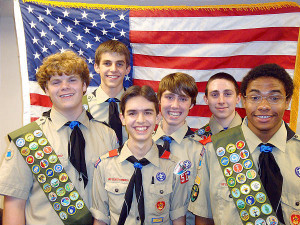 Mormon Boy Scouts A photo of six boy scouts in their uniforms, standing in front of the American flag.