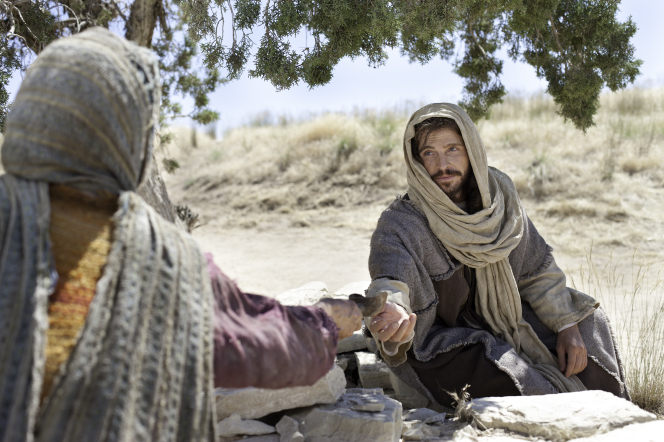 Jesus Christ with the woman at the well.