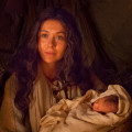 Mary holding the baby Jesus.