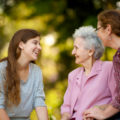 Woman laughing with her grandmother.