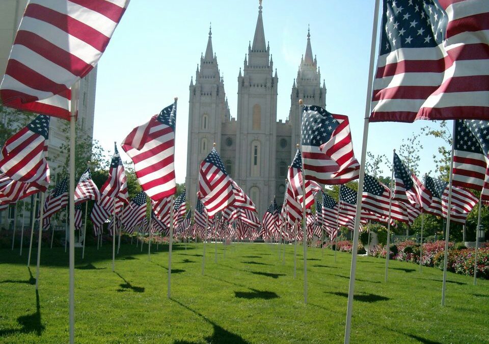 The Salt Lake City Temple is decorated with flags.