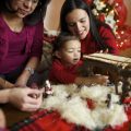 A family sets up a Nativity set to celebrate Christmas.