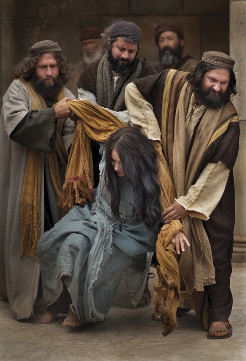 A group of angry men seek to stone a woman taken in adultery.